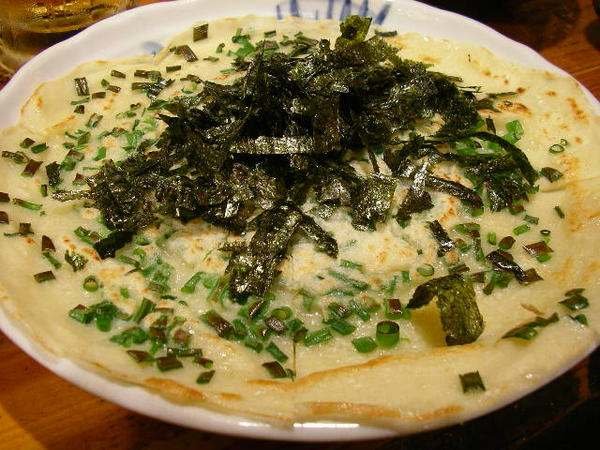 Japanese food:Okonomiyaki. Okonomiyaki are savory Japanese pancakes filled with meat, seafood and vegetables. They can be topped with mayonnaise, katsuobushi, n